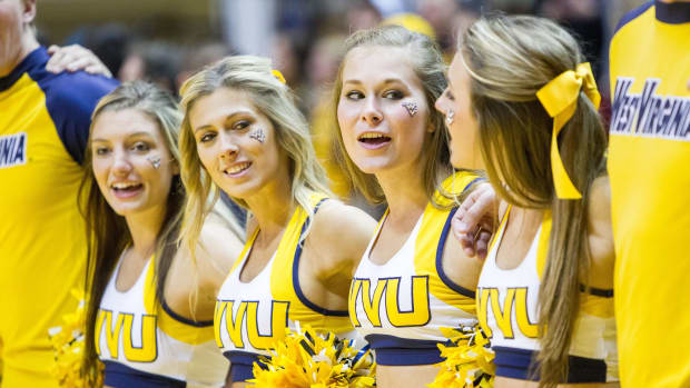 West Virginia Mountaineers cheerleaders celebrate after beating the Mississippi Valley State Delta Devils at WVU Coliseum.